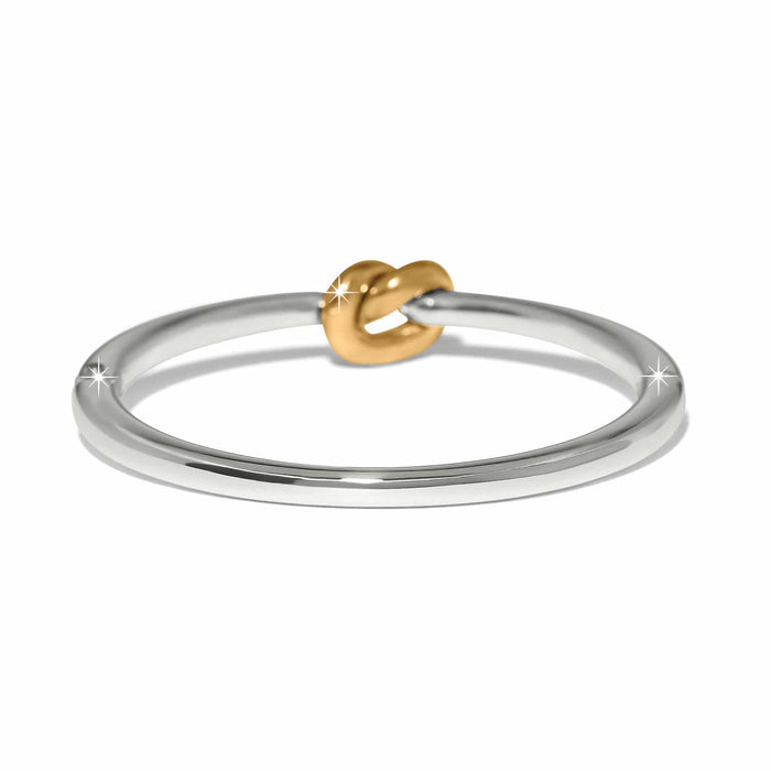 Brighton ring with silver-tone band and gold-tone knot accent at the center on a white background