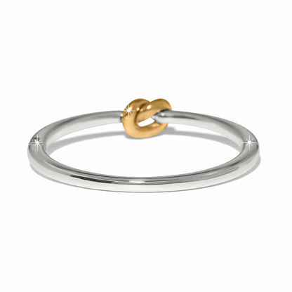 Brighton ring with silver-tone band and gold-tone knot accent at the center on a white background