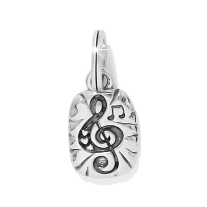 Brighton charm with silver-plated treble clef and music note design on textured background on a white background