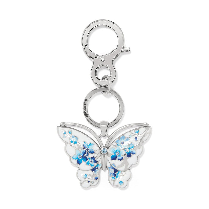 Brighton butterfly key fob with blue and white enamel floral wings, crystal accents, and silver-plated clasp on a white background