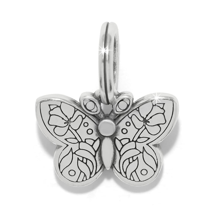 Brighton butterfly charm with silver-plated finish and engraved floral wing detail on a white background