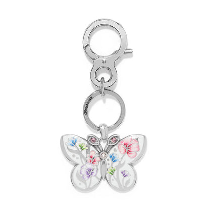 Brighton key fob with silver-plated butterfly charm featuring floral enamel design and pink crystal accents on a white background