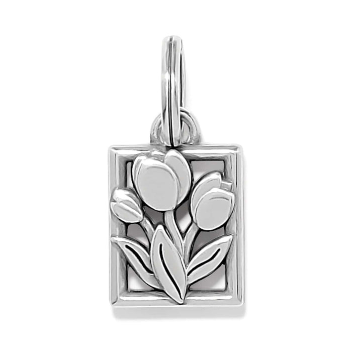 Brighton charm with silver-plated tulip and leaf design in rectangular frame with jump ring on a white background