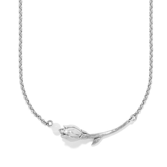 Brighton silver-plated necklace with tulip flower pendant and small white bead accent on a white background