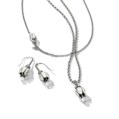 Brighton silver-plated necklace and drop earrings set with tulip flower pendants and white bead accents on a white background