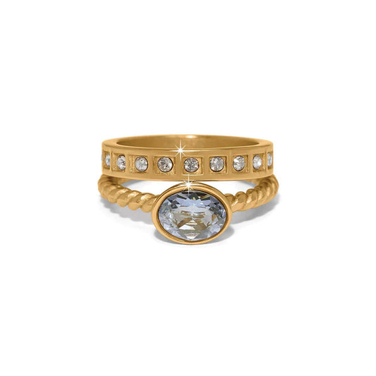 Brighton gold-plated stacked rings with oval crystal center stone and crystal-accented band on a white background