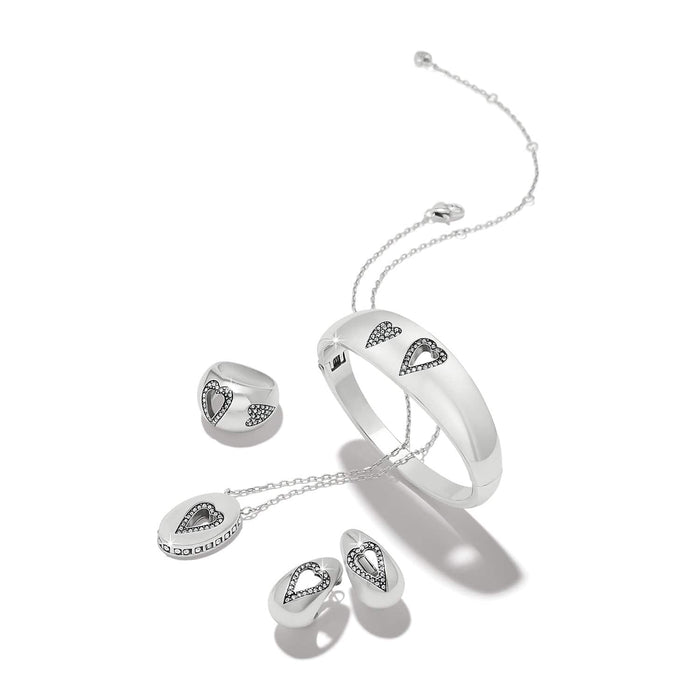 Brighton silver-plated jewelry set styled with heart-shaped crystal accents on bangle, ring, pendant necklace, and earrings