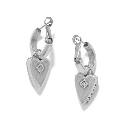Brighton hoop earrings with silver-plated heart charms, crystal accents, and engraved love detail on a white background