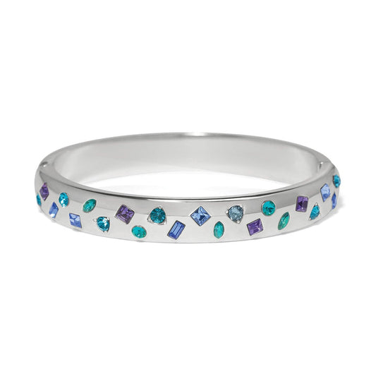 Brighton silver-plated bangle bracelet with scattered blue, purple, and teal crystals in mixed shapes on a white background