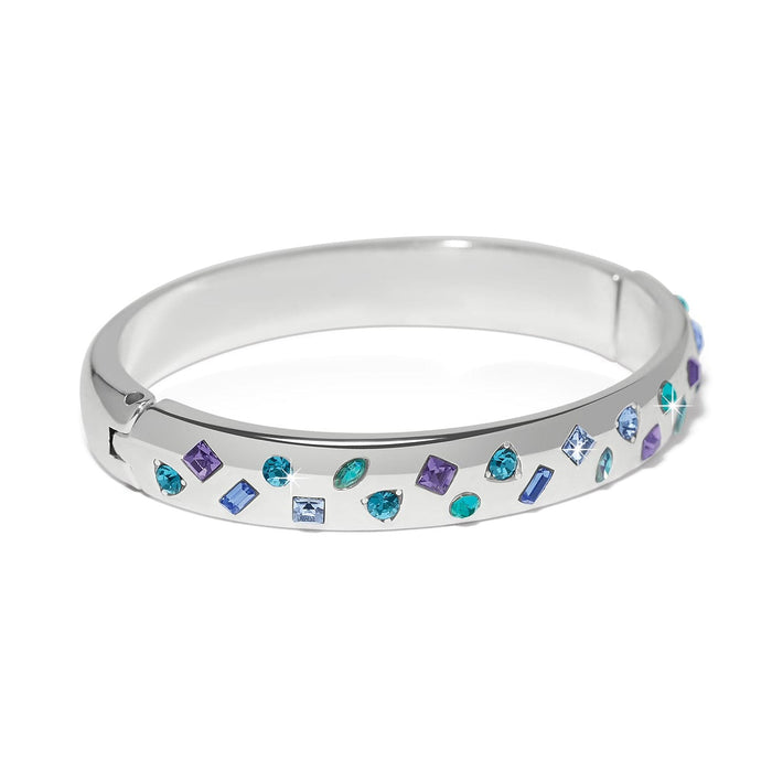 Brighton silver-plated bangle bracelet with scattered blue, teal, and purple crystals in mixed shapes on a white background
