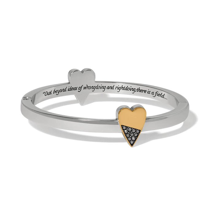 Brighton hinged bangle bracelet with two-tone heart accents, crystal pavé, and engraved inscription on a white background