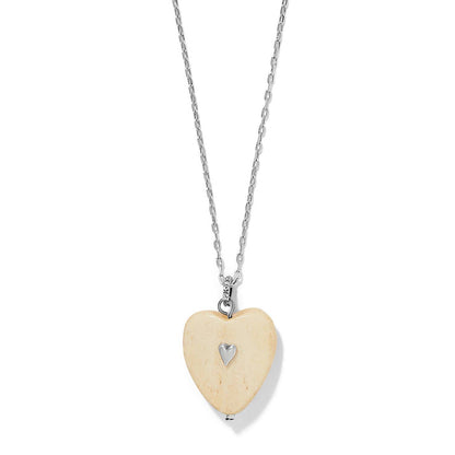 Brighton pendant necklace with cream wood heart, silver-plated heart accent, and silver-plated chain on a white background