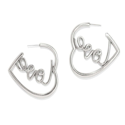 Brighton silver-plated heart hoop earrings with cursive love script detail inside each hoop on a white background