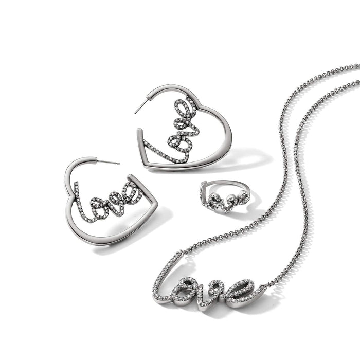 Brighton silver-plated love jewelry set styled with heart hoop earrings, ring, and crystal necklace on white background
