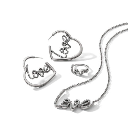 Brighton silver-plated jewelry set styled with heart hoop earrings, love ring, and matching love script necklace with crystals