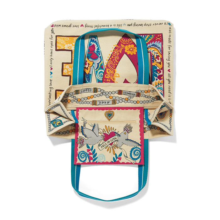 Brighton canvas tote bag shown open with LOVE print, dove interior pocket, and blue straps on a white background