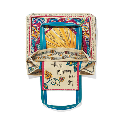 Brighton canvas tote bag shown open with paisley print, Life is a beautiful thing text, and teal handles on a white background