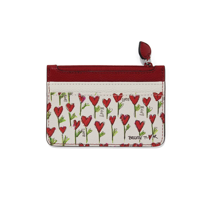 Brighton zip card case with red heart and love print, red leather trim, and heart pull on a white background