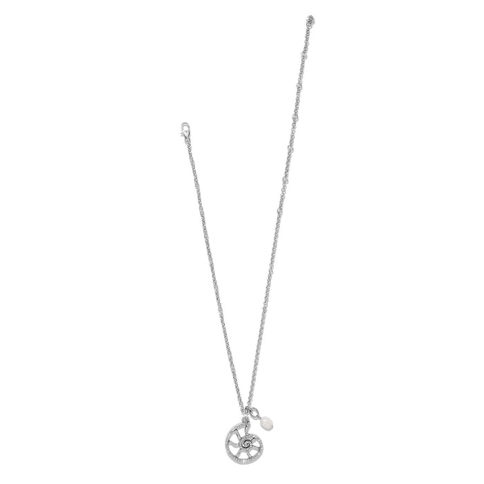 Brighton silver-plated necklace with circular spiral pendant, crystal accents, and pearl drop charm on a white background