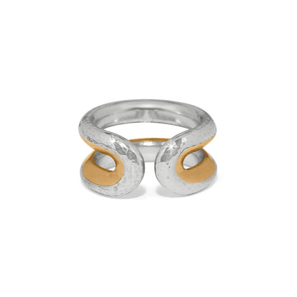 Brighton ring with hammered two-tone silver and gold open swirl design at the front on a white background