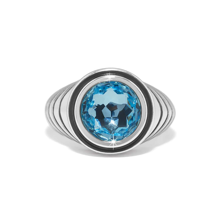 Brighton ring with large blue faceted crystal centerpiece and silver-plated ribbed band on a white background