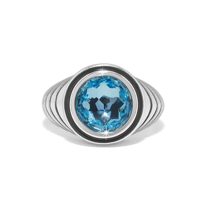 Brighton ring with large blue faceted crystal centerpiece and silver-plated ribbed band on a white background