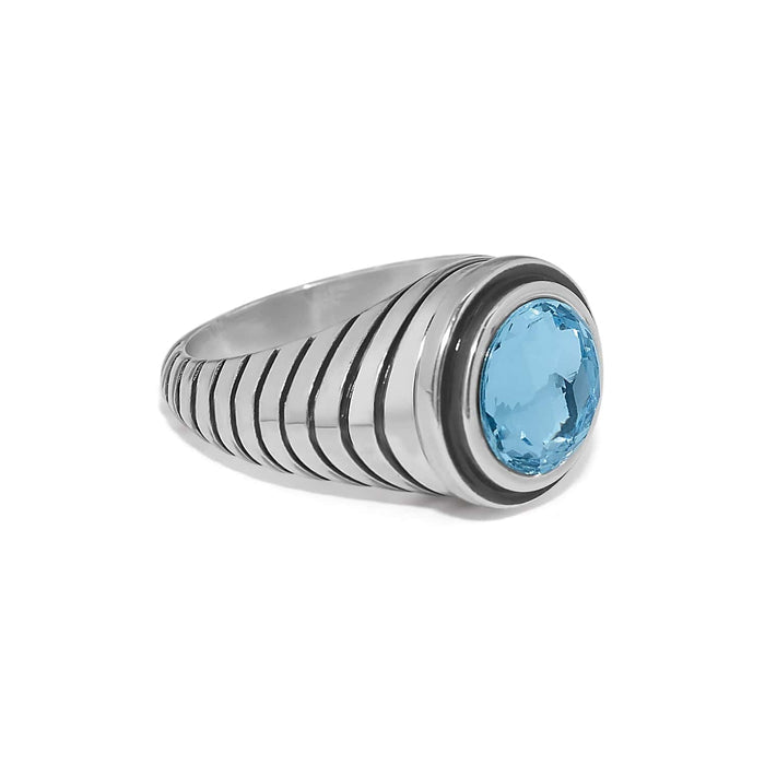 Brighton ring with round blue crystal and ribbed silver-plated band on a white background