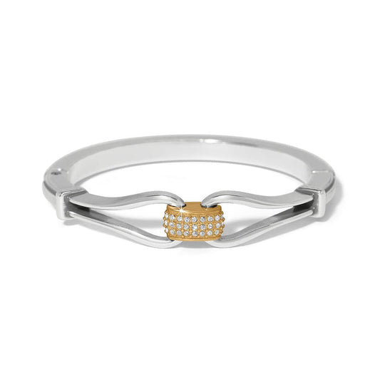 Brighton bangle bracelet with silver-plated curved band and gold-plated center station with crystal pavé on a white background
