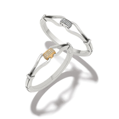 Brighton silver-plated bangle bracelets with crystal pavé centerpieces in silver and gold-plated finishes on a white background