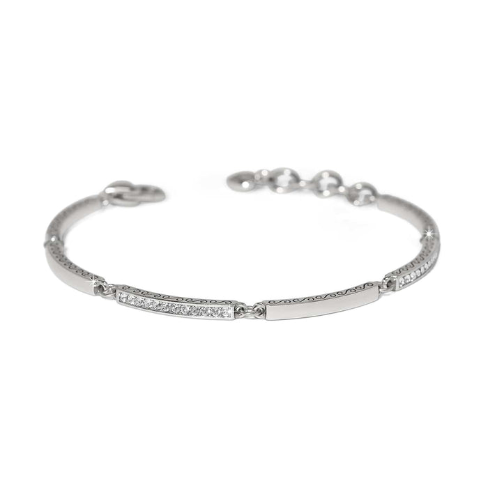 Brighton bangle bracelet with silver-plated finish, crystal-set bars, scroll engraving, and adjustable chain on a white background