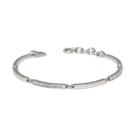 Brighton bangle bracelet with silver-plated finish, crystal-set bars, scroll engraving, and adjustable chain on a white background