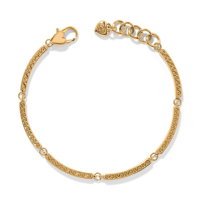 Brighton bracelet with gold-plated scrolled bar links, heart-shaped clasp, and adjustable chain extender on a white background