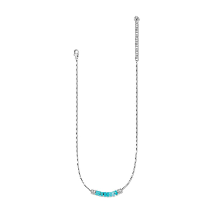 Brighton silver-plated necklace with turquoise beads, crystal accents, box chain, and lobster clasp on a white background