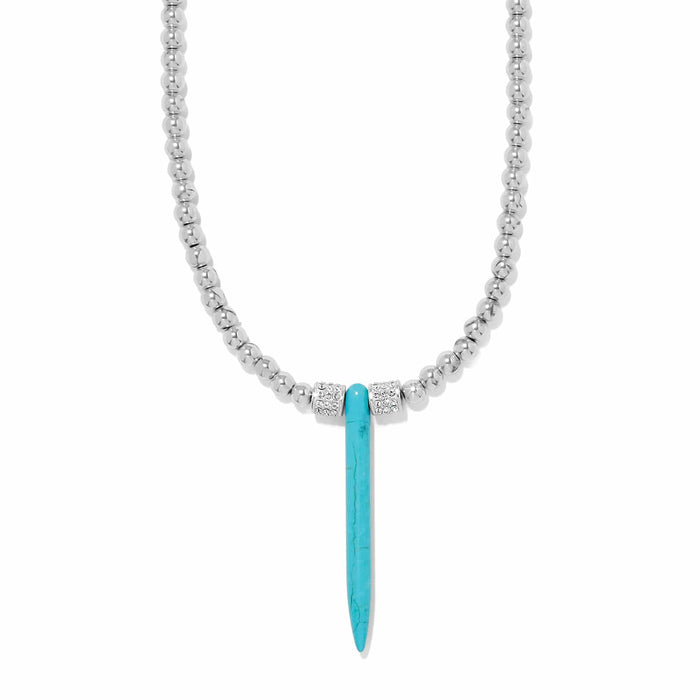 Brighton pendant necklace with silver-plated beaded chain, blue howlite turquoise spike, and crystal accents on a white background