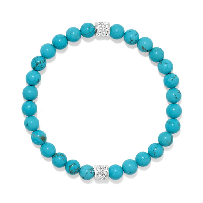 Brighton beaded bracelet with turquoise stones and two silver-plated crystal pavé accent beads on a white background