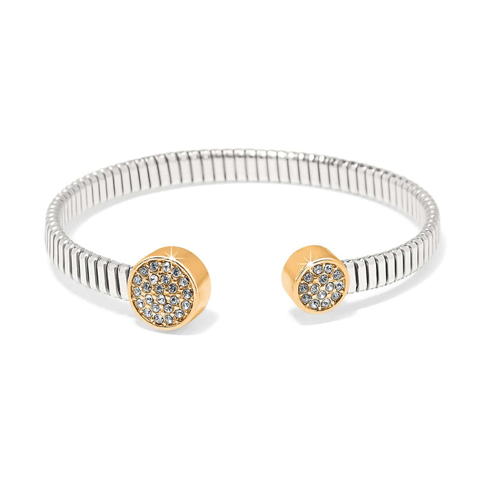 Brighton cuff bracelet with silver-plated ribbed band and gold-plated end caps featuring pavé crystals on a white background