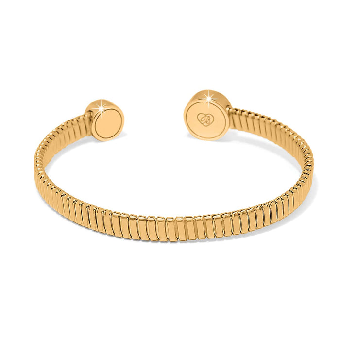 Brighton cuff bracelet with gold-plated ribbed band and round end caps with engraved logo on a white background