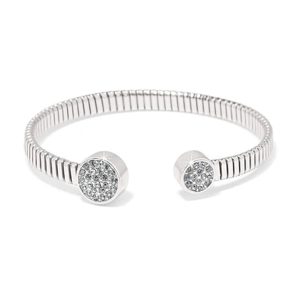 Brighton cuff bracelet with ribbed silver-plated band and crystal pavé disc end caps on a white background