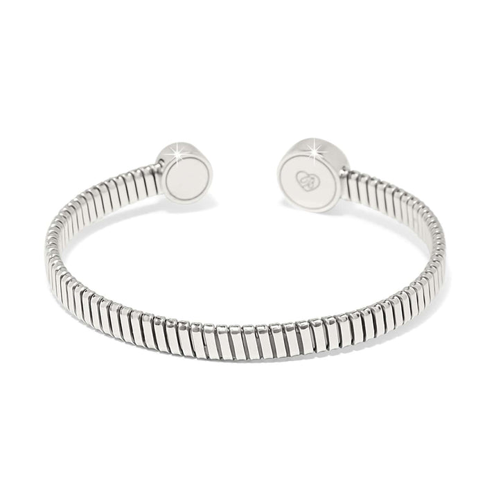 Brighton cuff bracelet with ribbed silver-plated band and round engraved logo end caps on a white background