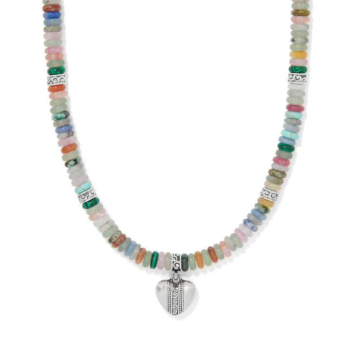 Brighton beaded necklace with multicolor gemstones, silver-plated scroll accents, and heart pendant on a white background