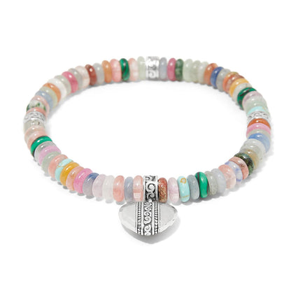 Brighton beaded bracelet with multicolored stone discs, silver-plated scroll accents, and heart charm on a white background