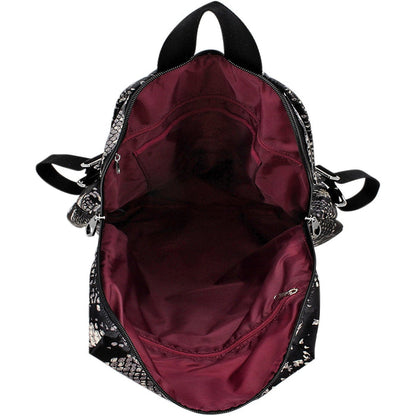 Close-up of Brighton backpack interior view with burgundy lining, zippered pocket, and snakeskin print exterior