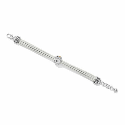 Brighton bracelet with white leather cords, two-tone decorative beads, lobster clasp, and extender chain on a white background