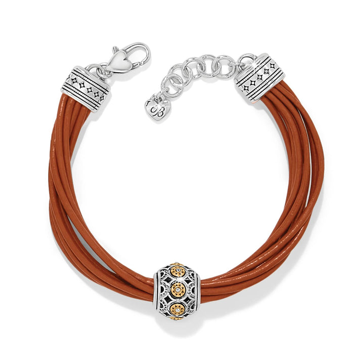 Brighton bracelet with brown leather cords, two-tone beaded charm, and silver-tone clasp on a white background