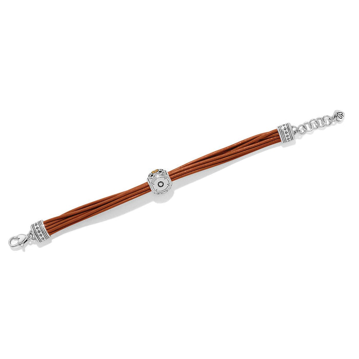 Brighton bracelet with brown leather cords, two-tone decorative bead, silver-tone end caps, and lobster clasp on a white background