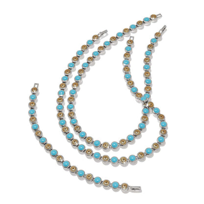 Brighton necklace and bracelet set with turquoise beads and two-tone medallion stations on a white background
