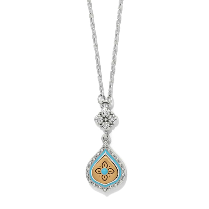Brighton pendant necklace with two-tone teardrop, turquoise enamel, gold floral center, and crystal accents on a white background