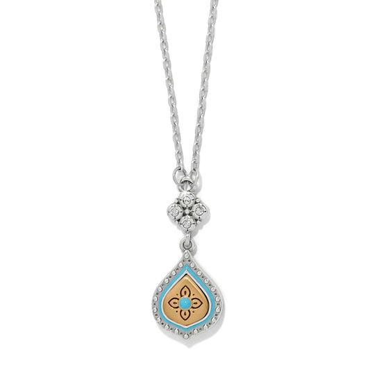 Brighton pendant necklace with two-tone teardrop, turquoise enamel, gold floral center, and crystal accents on a white background