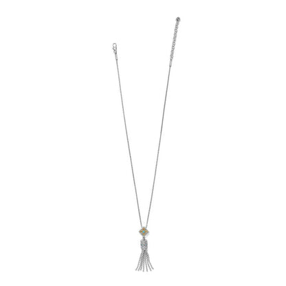 Brighton tassel pendant necklace with two-tone enamel medallion, crystal accent, and silver-tone tassel on a white background