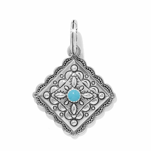 Brighton silver-plated pendant charm with ornate scalloped diamond shape and turquoise enamel center stone on a white background